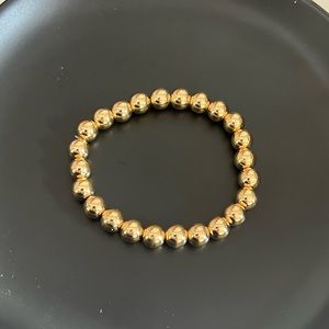 Gold and Silver stretchy bracelets .